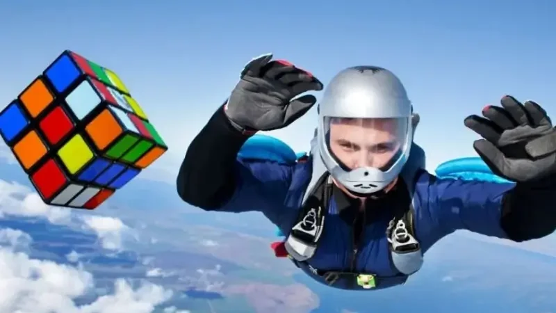 Man solves two Rubik's cubes while skydiving to break world record