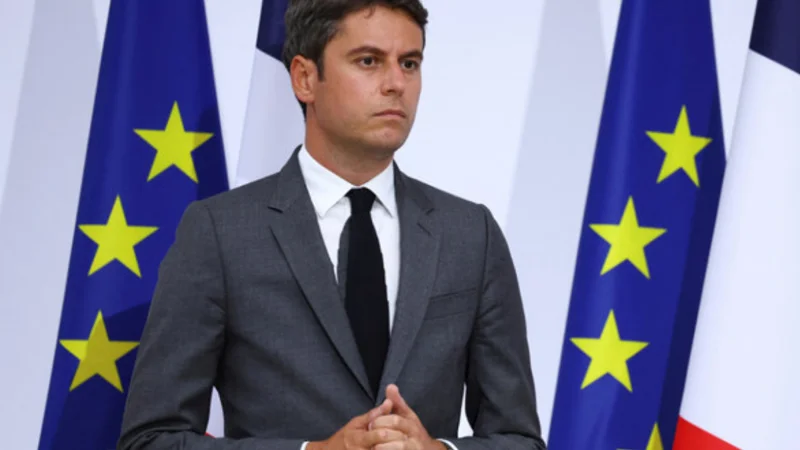 French PM looks to rebuild political support after party backing