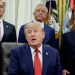 Trump signs law opening door to 100% tariffs on China, India