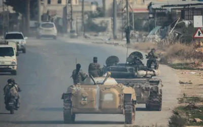 Syrian rebels sweep into Aleppo, army closes airport and roads