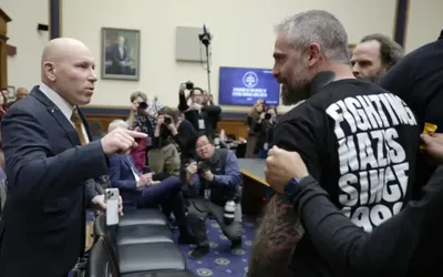 Chaos at Capitol hearing as former officer confronts with Ivan Raiklin