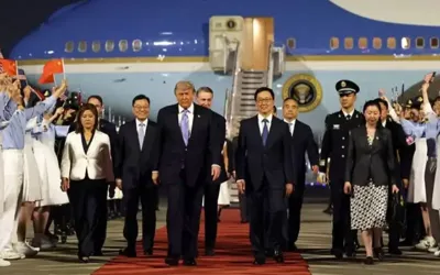 Donald Trump lands in China for talks with Xi