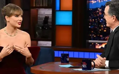 Taylor Swift stuns in $1,695 velvet minidress for "The Late Show with Stephen Colbert"
