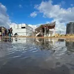 Deadly strikes in Gaza coincide with heavy flooding across strip